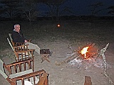Enjoying the campfire and listening to sounds of Africa